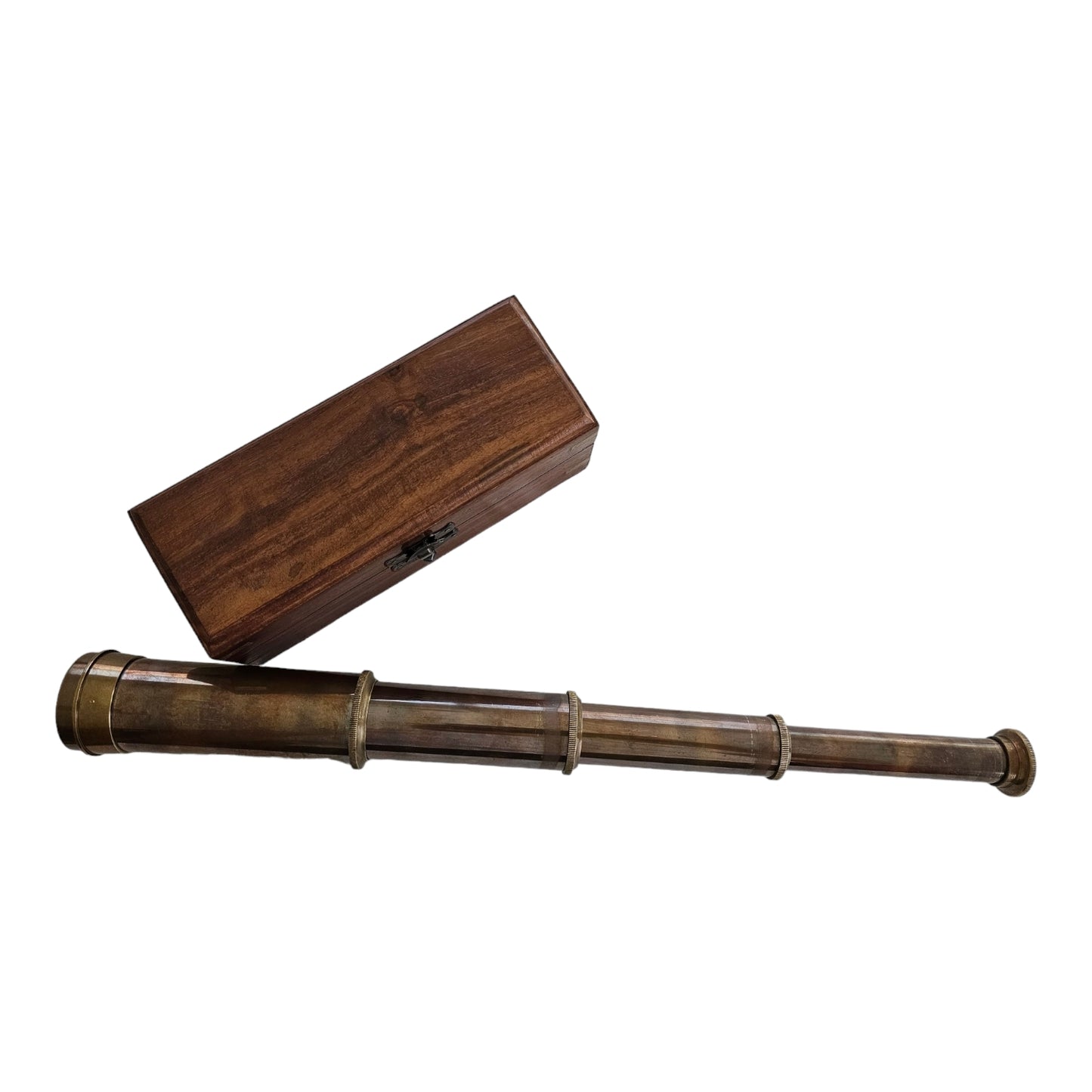 Close-up of the brass telescope lens, highlighting high-quality optics and 10x magnification.