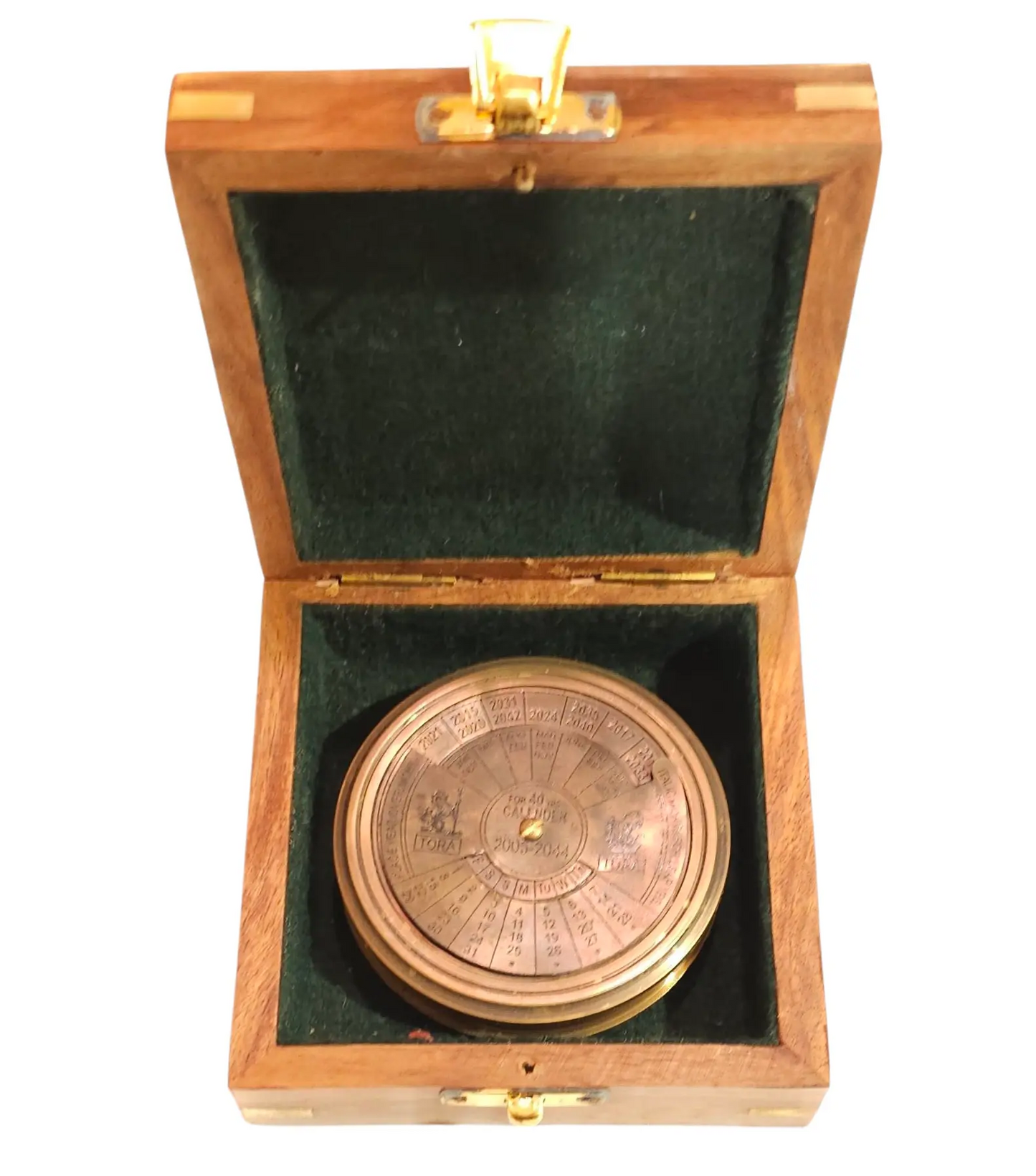 Brass compass in a wooden box with green interior