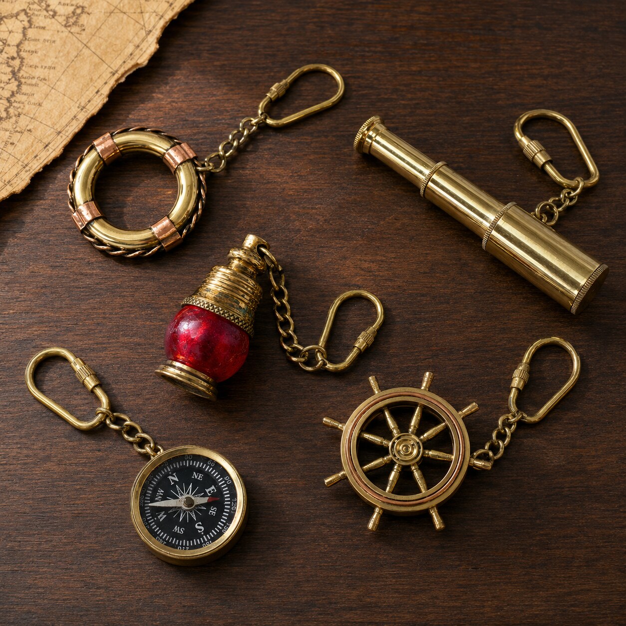 Brass nautical keyrings including lifebuoy, telescope, lamp, compass and ship wheel