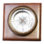 Dollond London compass | Close-up of the brass compass showing cardinal directions and vintage typography.