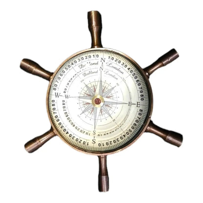 Wheel compass used as desk decor, blending functionality with antique charm.