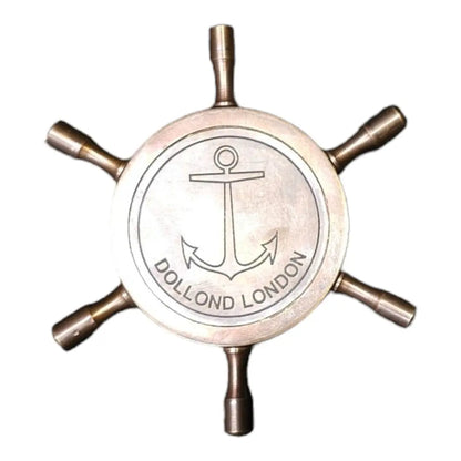 Brass compass displayed backside Dollond London, ideal for hiking, camping, and adventure.