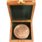 Brass compass in a wooden box with green interior