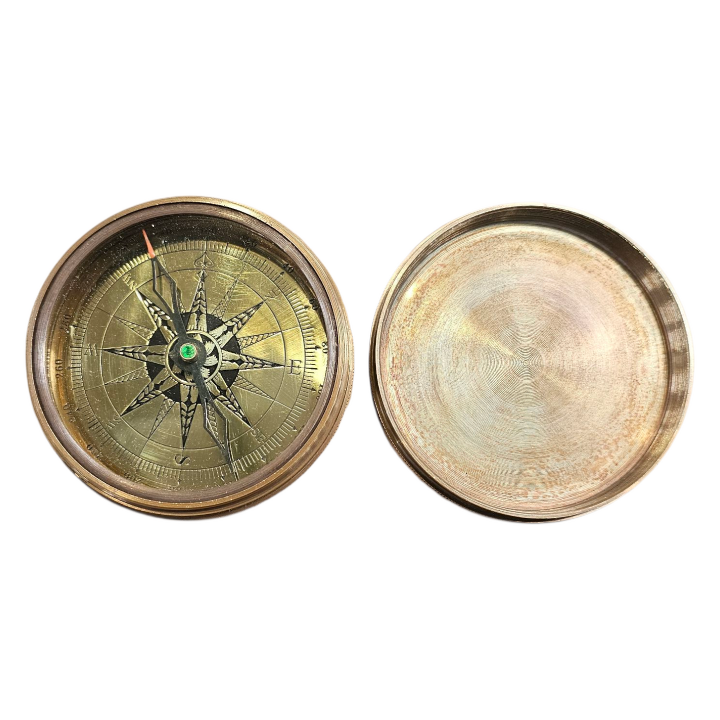 Brass compass with detailed design on a white background