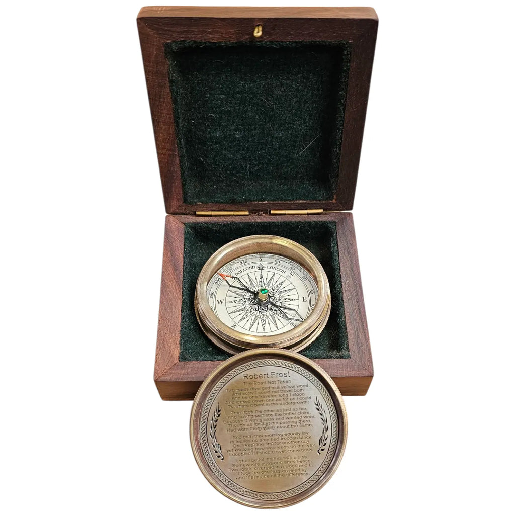 Brass compass with a white dial