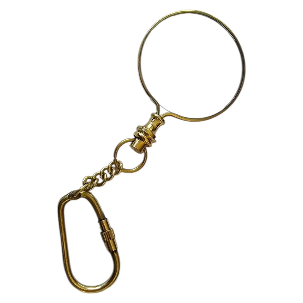 Gold metal keychain with a magnifying glass on a white background