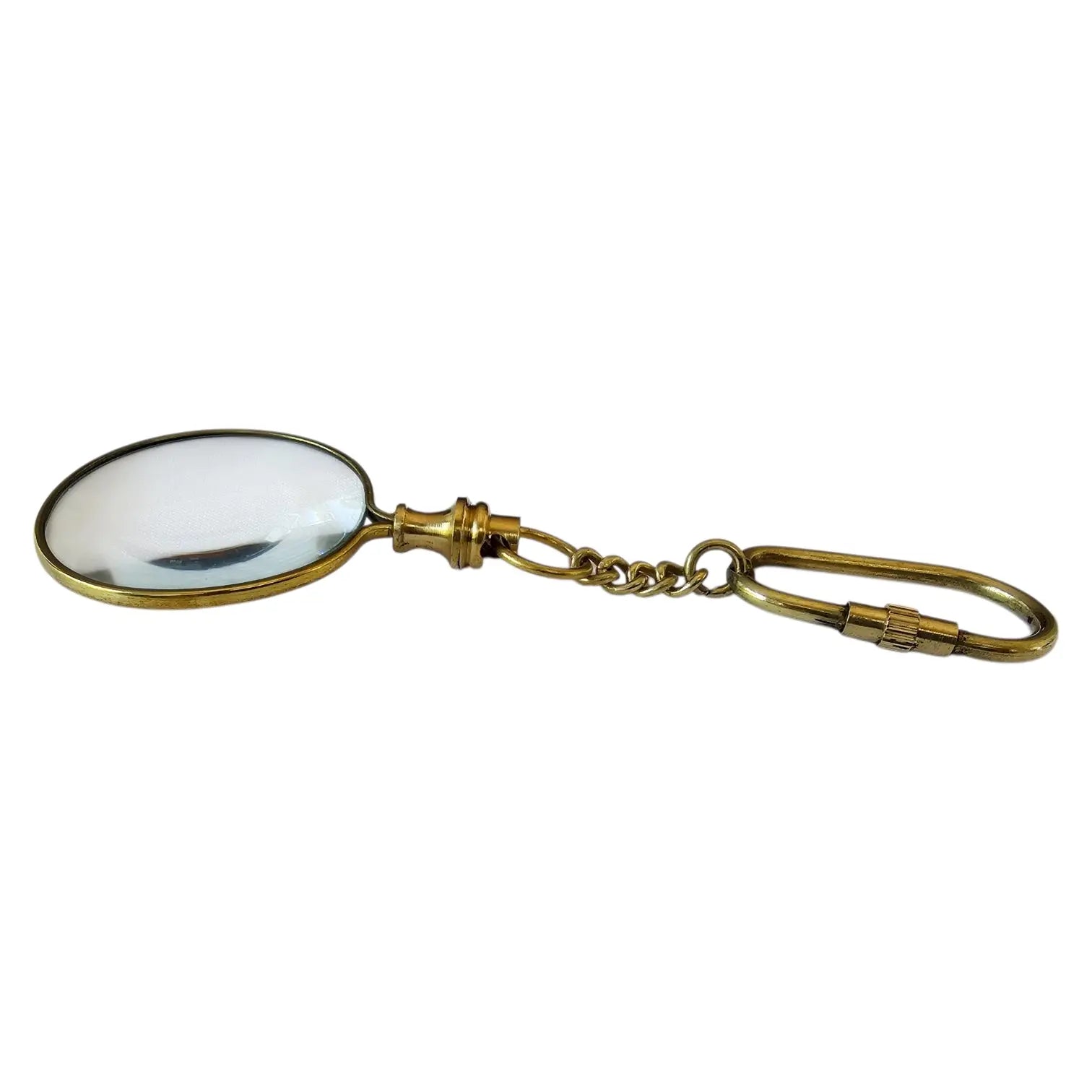 Brass magnifying glass keychain on a white background