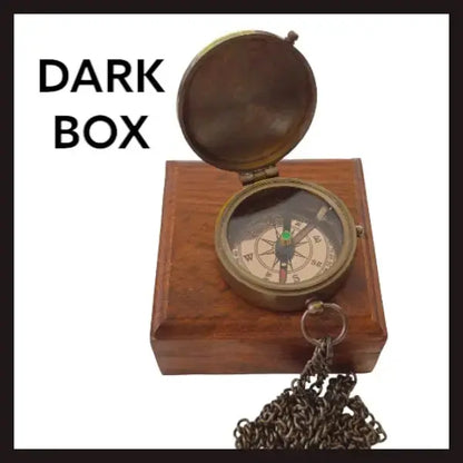Compass with a dark timber box