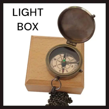 Compass with a light wooden box