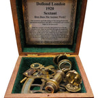 1920 sextant in a wooden box with an informational label