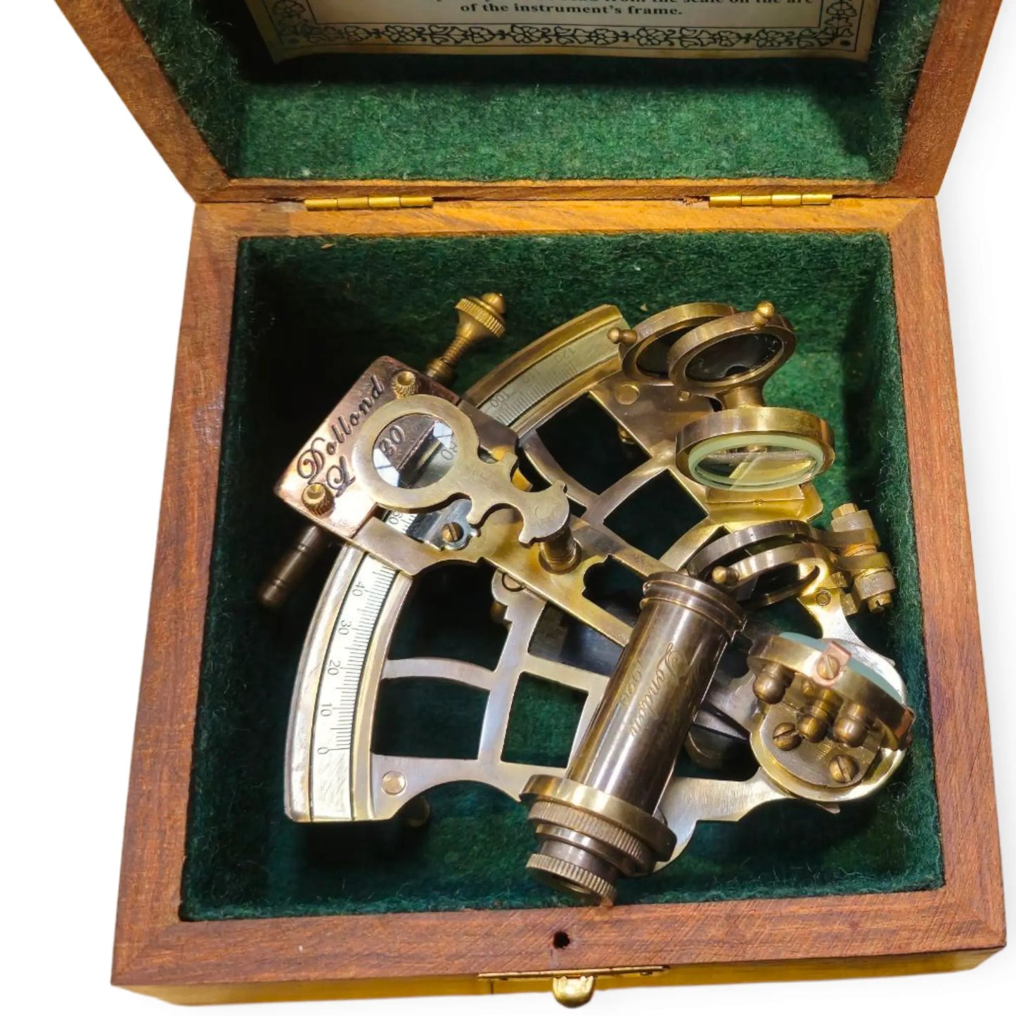Vintage sextant in a wooden box with green interior
