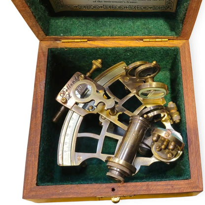 Vintage sextant in a wooden box with green interior