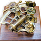 Brass sextant on a wooden surface